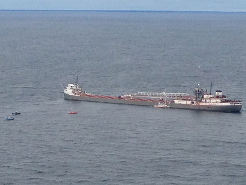 Bulk Carrier Michipicoten assists sailboat